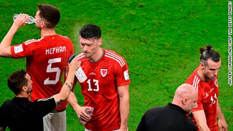 Wales forward Kieffer Moore is sprayed with water his team&#39;s game against England.