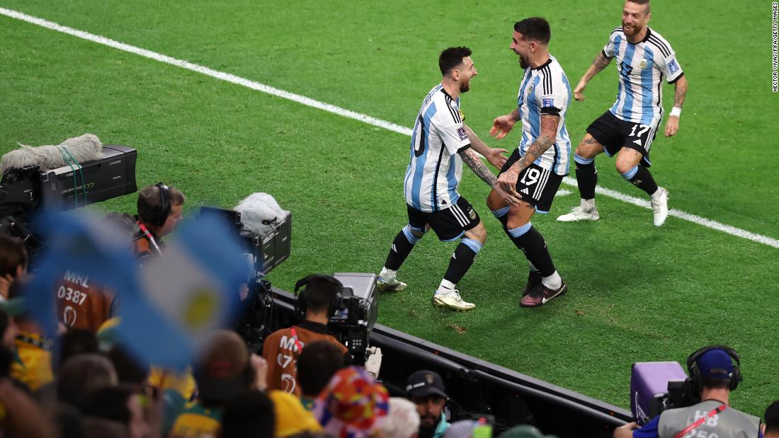 Argentina&#39;s Lionel Messi, left, celebrates with teammates after opening the scoring against Australia on December 3. Argentina&#39;s 2-1 victory set up a quarterfinal match against the Netherlands.