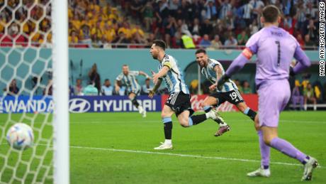 Messi celebrates after he scores against Australia. 