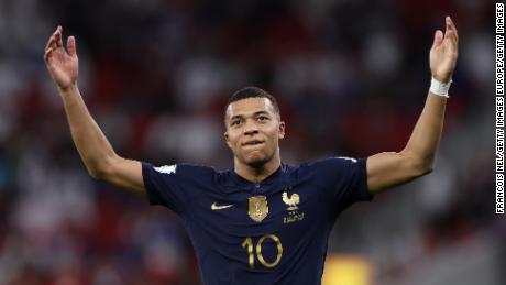 Kylian Mbappe celebrates after scoring his second goal against Poland.