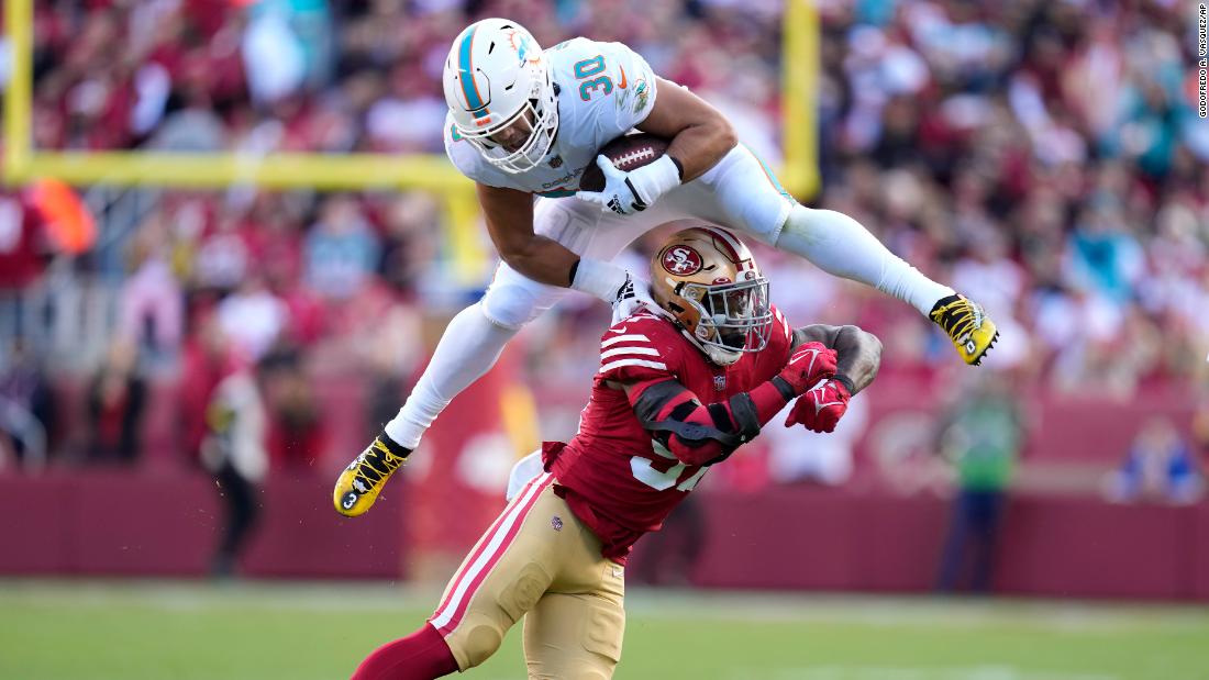 Miami Dolphins fullback Alec Ingold hurdles over San Francisco 49ers linebacker Dre Greenlaw during the first half of the teams&#39; game. The 49ers, despite losing starting quarterback Jimmy Garoppolo to a season-ending injury early on, beat the Dolphins 33-17. 