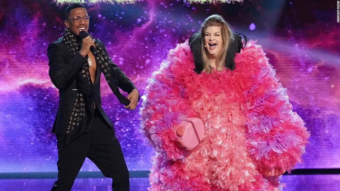 Nick Cannon and Alley react during Alley&#39;s unmasking on &quot;The Masked Singer&quot; earlier this year. 