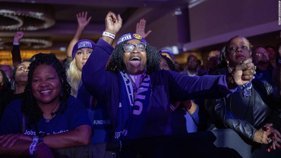 Supporters of US Sen. Raphael Warnock react during his election night party in Atlanta on Tuesday, December 6. Warnock will win Georgia&#39;s runoff election, CNN projects, defeating Republican challenger Herschel Walker.