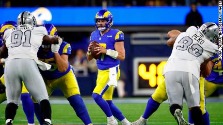 Los Angeles Rams quarterback Baker Mayfield looks to pass against the Las Vegas Raiders during the first quarter of Thursday night&#39;s game.