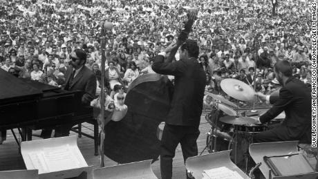 Vince Guaraldi, left, plays piano at a jazz festival in 1966.