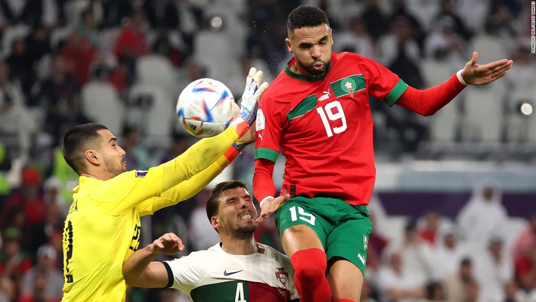 Youssef En-Nesyri heads the ball to score Morocco&#39;s goal against Portugal.