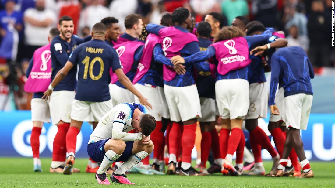 England&#39;s Mason Mount appears dejected as French players celebrate their 2-1 quarterfinal win at the World Cup on December 10.