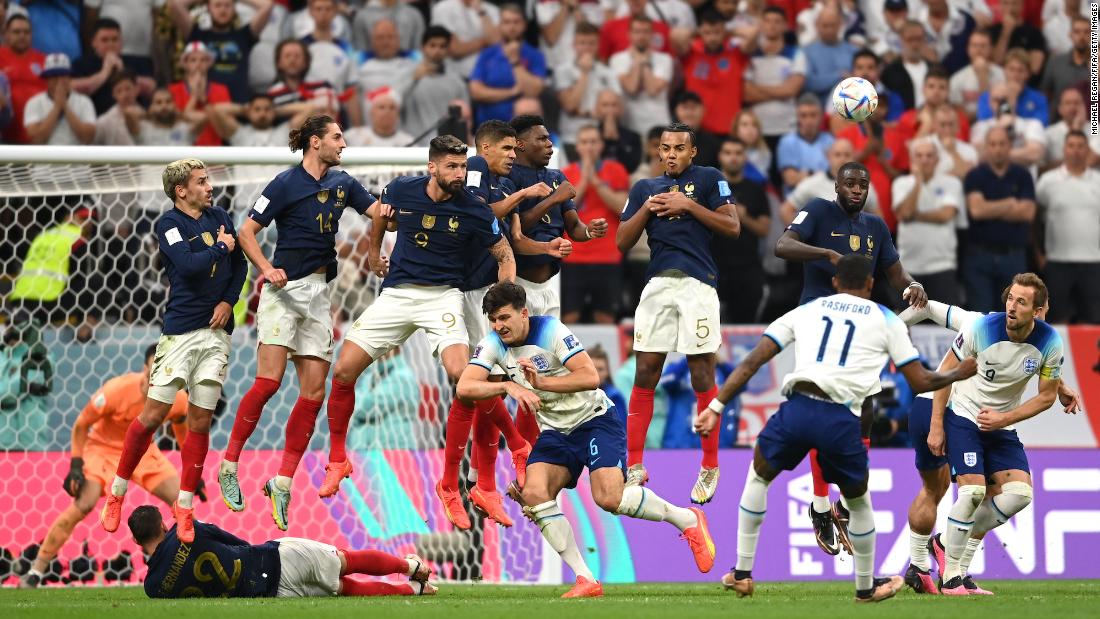 French players try to block a Marcus Rashford free kick late in the match.