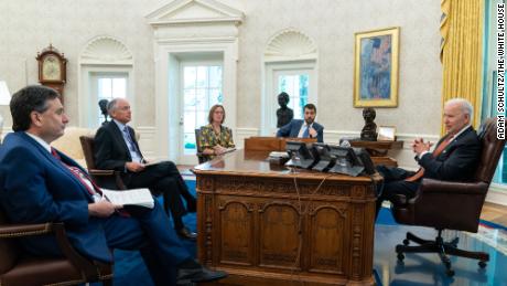 Ron Klain, Steve Ricchetti, Louisa Terrell and Brian Deese join President Biden in the Oval Office in 2021.