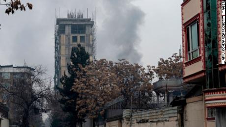 Smoke rises from the site of an attack in Shahr-e-naw, Kabul, Afghanistan, on December 12.