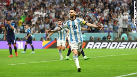 Lionel Messi celebrates after scoring Argentina&#39;s first goal from the penalty spot.