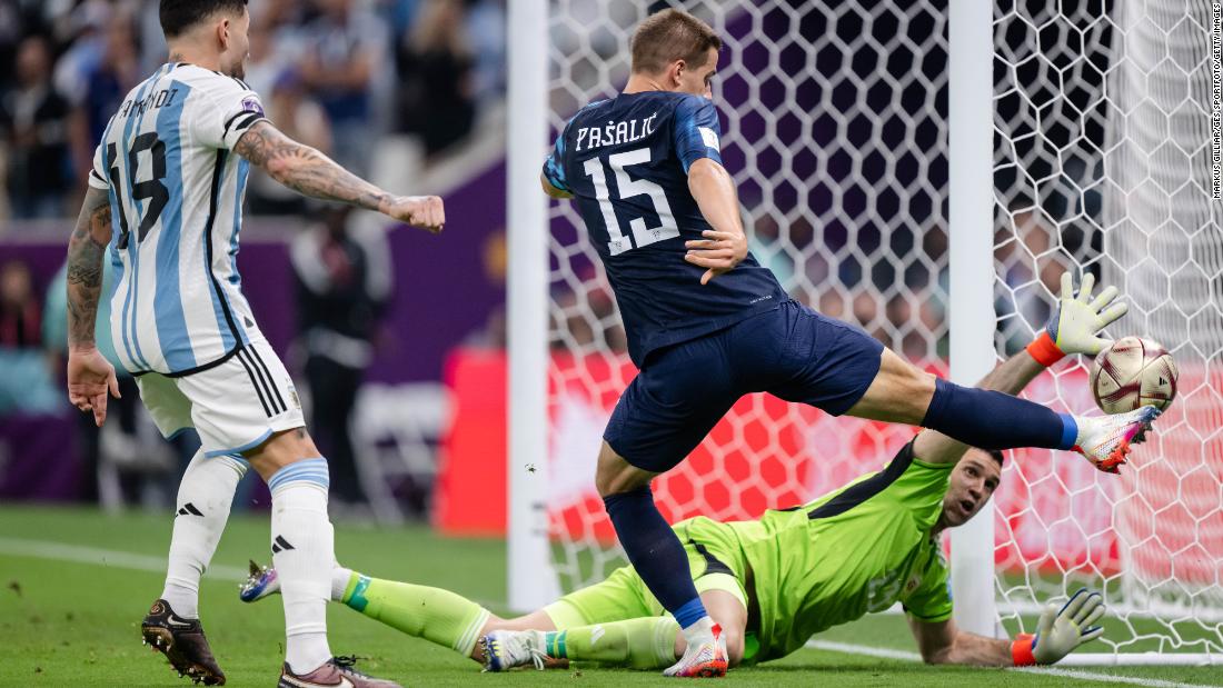 Argentina goalkeeper Emiliano Martinez reaches out for a save against Croatia.