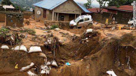 A car is seen stuck after heavy rains caused floods and landslides, on the outskirts of Kinshasa, Democratic Republic of Congo December 13,2022.