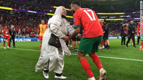 Sofiane Boufal celebrates with his mother on the pitch after Morocco broke records by beating Portugal in the Qatar 2022 World Cup quarterfinal.