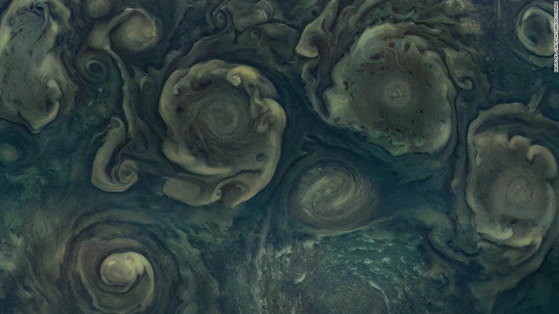 Jupiter&#39;s northernmost cyclone, seen to the right along the bottom edge of image, was captured by Juno.