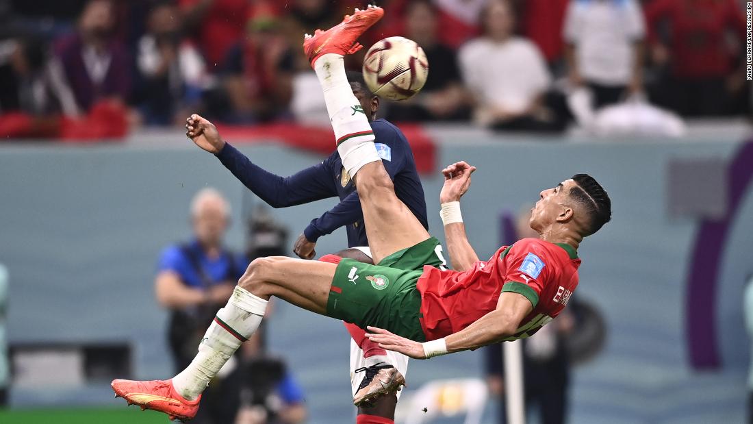 Morocco&#39;s Jawad El Yamiq attempts a bicycle kick during the first half against France. His shot clanged off the post.