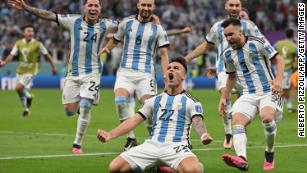 Argentina&apos;s forward Lautaro Martinez celebrates after scoring his spot kick and defeating Netherlands in the penalty shootout. 