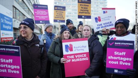 Members of the Royal College of Nursing stand on a picket line outside St. Thomas&#39; Hospital in London on Thursday December 15, 2022. 