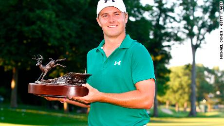 Spieth holds the John Deere Classic trophy aloft after victory in July 2013.