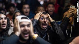 Moroccan fans react while watching the Morocco national team lose to France in the semi final of the World Cup played in Qatar, in Rabat, Morocco, Wednesday, Dec. 14, 2022. (AP Photo/Mosa&#39;ab Elshamy)