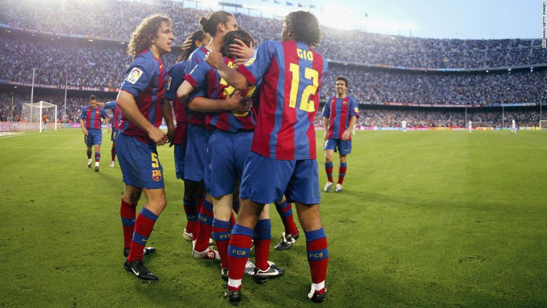 Messi is congratulated by Barcelona teammates after scoring his first goal for the club on May 1, 2005. Messi was 17 years old.