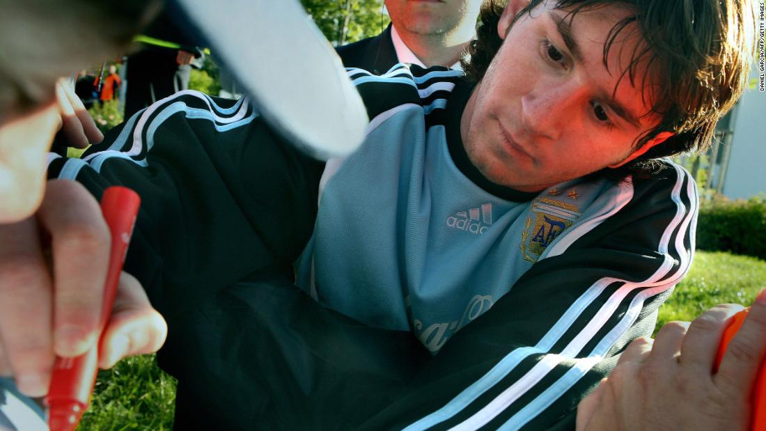 Messi signs autographs while training ahead of the World Cup in Germany in June 2006.