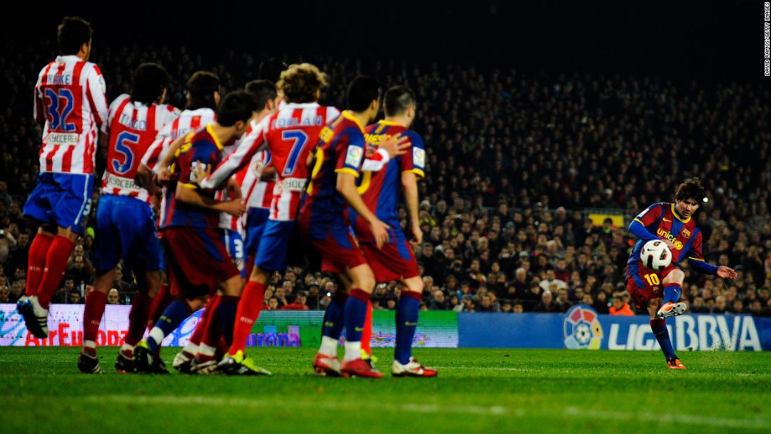 Messi takes a free kick during a Spanish league match against Atlético Madrid in 2011. During the 2011-12 season, Messi scored 73 goals, setting the all-time record for most goals scored in a season for a major European football league.