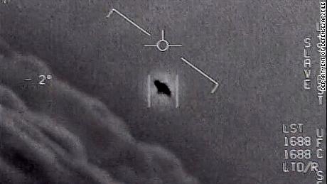 The image from video provided by the Department of Defense labelled Gimbal, from 2015, an unexplained object is seen at center as it is tracked as it soars high along the clouds, traveling against the wind. &quot;There&#39;s a whole fleet of them,&quot; one naval aviator tells another, though only one indistinct object is shown. &quot;It&#39;s rotating.&quot; The U.S. government has been taking a hard look at unidentified flying objects, under orders from Congress, and a report summarizing what officials know is expected to come out in June 2021. (Department of Defense via AP)