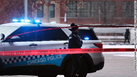 Chicago police secure a crime scene on the campus of Benito Juarez Community Academy high school in Chicago where four people were shot after school on Dec. 16, 2022. One of the four died. (Terrence Antonio James/The Chicago Tribune/Tribune News Service via Getty Images)