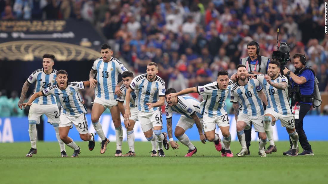 Argentina players react after Gonzalo Montiel scored his penalty to clinch the shootout victory.