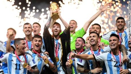 LUSAIL CITY, QATAR - DECEMBER 18: Lionel Messi of Argentina lifts the FIFA World Cup Qatar 2022 Winner&#39;s Trophy after the FIFA World Cup Qatar 2022 Final match between Argentina and France at Lusail Stadium on December 18, 2022 in Lusail City, Qatar. (Photo by Shaun Botterill - FIFA/FIFA via Getty Images)