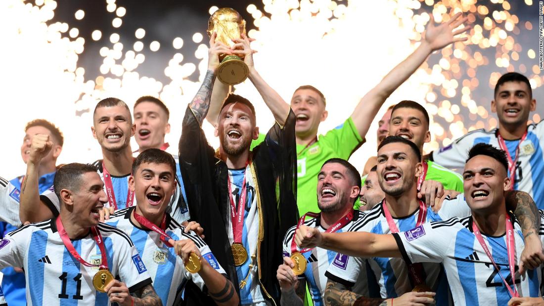 Messi lifts the World Cup trophy.