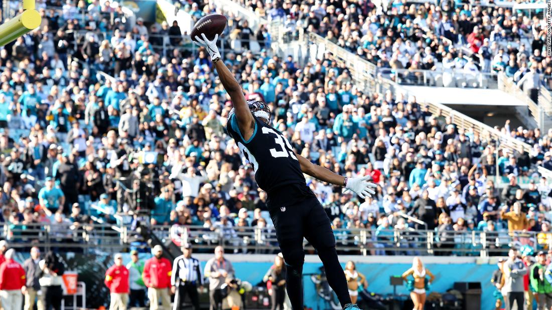 Jamal Agnew of the Jacksonville Jaguars attempts to catch a pass against the Dallas Cowboys during the second half. The Cowboys lost 40-34 in overtime after Rayshawn Jenkins&#39; 52-yard interception was returned for a touchdown. 
