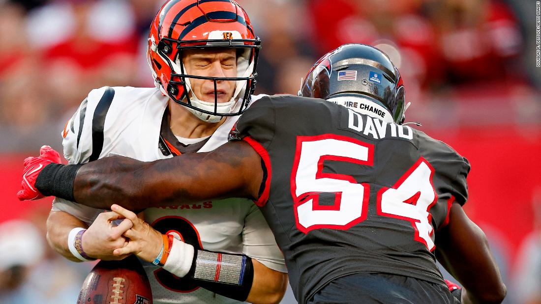 Joe Burrow of the Cincinnati Bengals is sacked by Lavonte David of the Tampa Bay Buccaneers during the second quarter at Raymond James Stadium. Burrow threw four touchdowns as the Bengals overcame a 17-point deficit to beat Tom Brady and the Bucs 34-23.