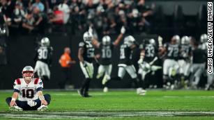 Atlanta Falcons quarterback Chris Chandler tries to elude Broncos News  Photo - Getty Images