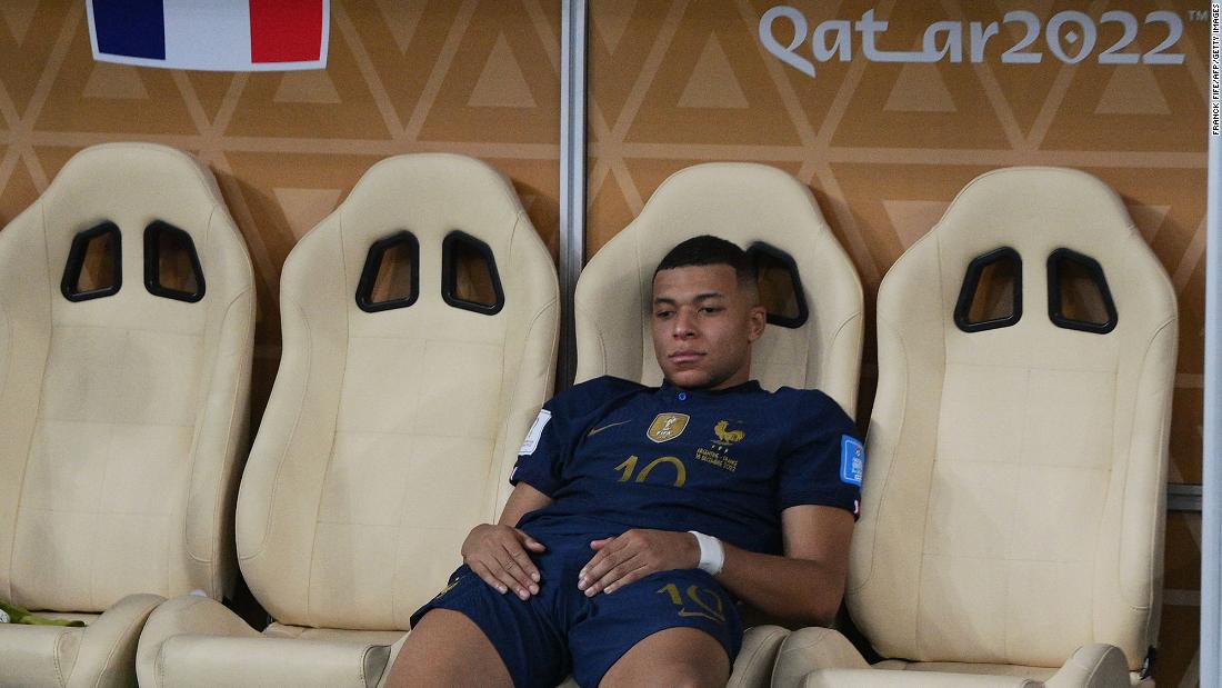 French star Kylian Mbappé sits on the team&#39;s bench after the loss.