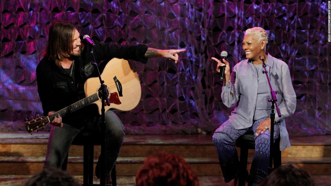 Billy Ray Cyrus and Warwick perform a duet on &quot;The Talk&quot; in 2014. The pair collaborated on the song &quot;Love Is Just Ahead.&quot;