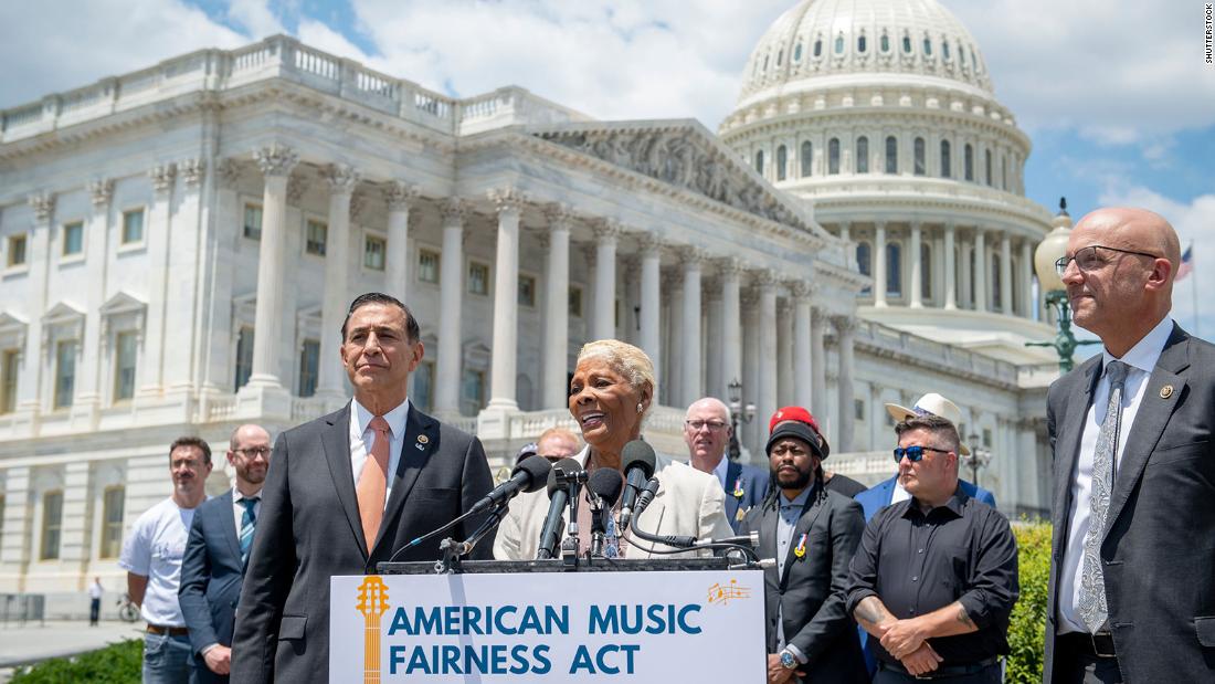 US Rep. Darrell Issa, left, listens as Warwick introduces the American Music Fairness Act in Washington, DC, in June 2021. Warwick has been an outspoken supporter of musical artists and has lobbied Congress to pass laws that would ensure they receive fair compensation. 