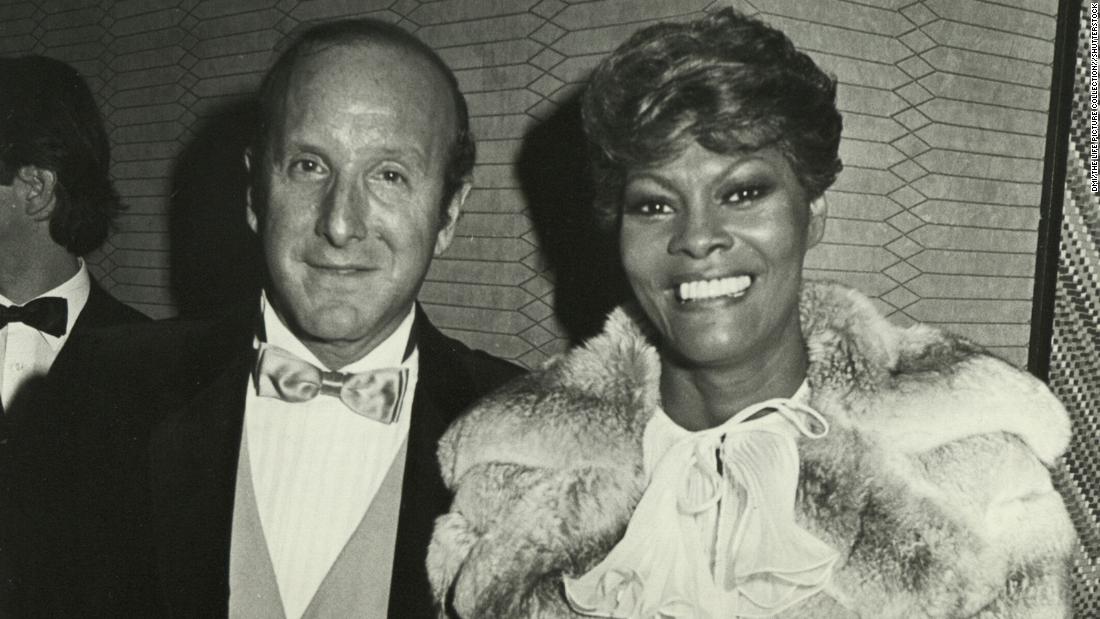 Record producer Clive Davis and Warwick pose for a photo in 1990. Davis signed Warwick to Arista Records in 1979.