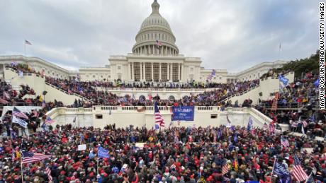 Supporters of President Donald Trump swarm the Capitol building in this January 6, 2021 file photo. 