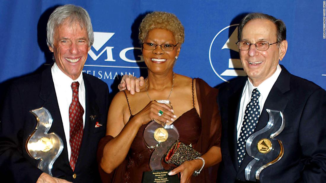 From left, Bacharach, Warwick and Hal David pose with their statues at the NARAS Heroes Awards in 2002. Bacharach and David &lt;a href=&quot;https://www.cnn.com/2012/09/02/showbiz/hal-david-last-songs/index.html&quot; target=&quot;_blank&quot;&gt;co-wrote&lt;/a&gt; many of Warwick&#39;s hit songs and said she was their muse. 