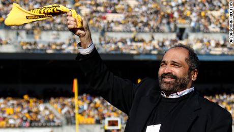 Former Pittsburgh Steeler Franco Harris twirls a Terrible Towel before the start of the Steelers NFL football game against the Cincinnati Bengals in Pittsburgh, Pennsylvania, December 23, 2012. Harris was at the game to commemorate the 40th anniversary of the &quot;Immaculate Reception.&quot;