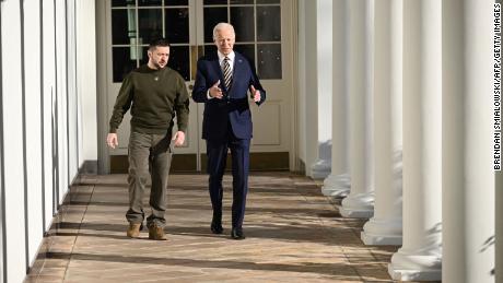 US President Joe Biden walks with Ukraine&#39;s President Volodymyr Zelensky through the colonnade of the White House, in Washington, DC on December 21, 2022. - Zelensky is in Washington to meet with US President Joe Biden and address Congress -- his first trip abroad since Russia invaded in February. (Photo by Brendan SMIALOWSKI / AFP) (Photo by BRENDAN SMIALOWSKI/AFP via Getty Images)