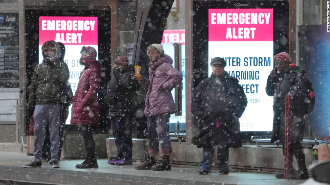 Bus riders wait at a sheltered stop in Chicago on December 22.