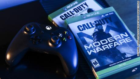 Activision Blizzard&#39;s Call of Duty: Modern Warfare video game and Microsoft&#39;s Xbox One video game controller arranged in Denver, Colorado, U.S., on Wednesday, Jan. 19, 2022.