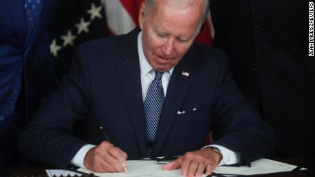 President Joe Biden signs &quot;The Inflation Reduction Act of 2022&quot; into law during a ceremony in the State Dining Room of the White House in August.