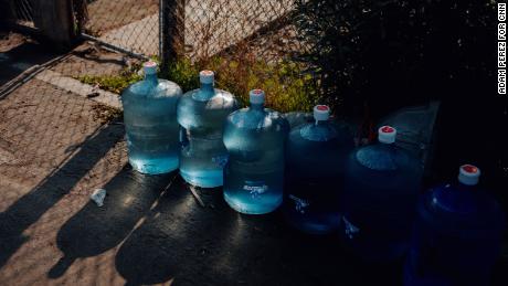 Six five-gallon jugs of water are delivered to a resident&#39;s home in Tooleville.