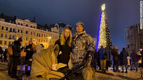 A Ukrainian couple pictured in Kyiv&#39;s Sophia Square on Christmas Day in the Ukrainian capital.