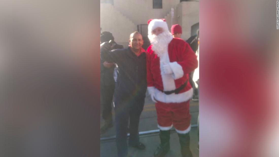 Sending a photo with Santa Claus, a migrant father waiting in El Paso tells son in Venezuela his Christmas gift may be delayed