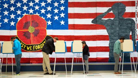 Voters cast their ballots at an elementary school in Midlothian, Virginia, on November 8, 2022. 